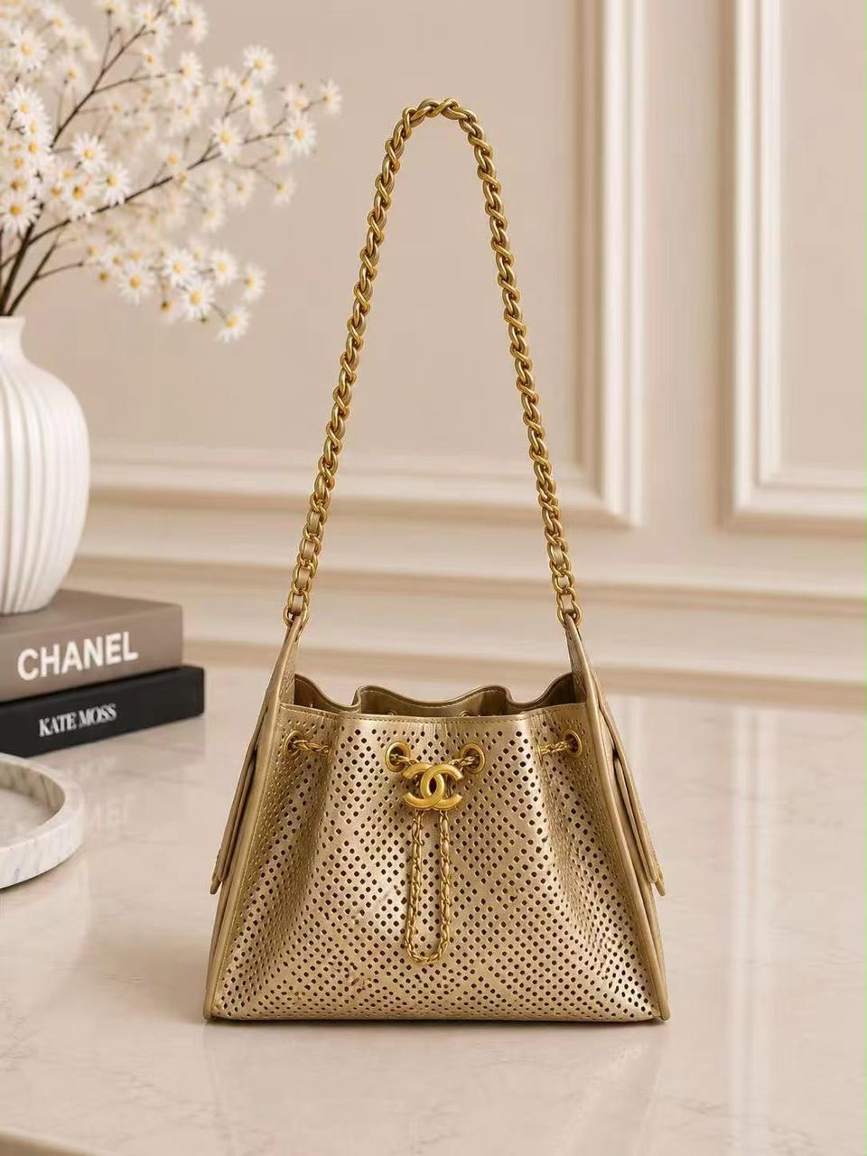 Chanel Perforated Drawstring Bucket Bag – Metallic Gold
